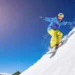 Summit Pursuits: Scaling Peaks and Embracing Majesty in Mountain Sky